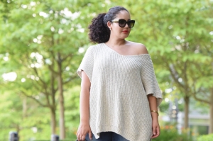Tanesha Awasthi (formerly known as Girl with Curves) wearing an off shoulder plus size sweater.