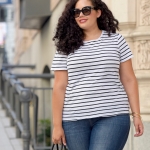 Tanesha Awasthi (curly hair girl with curves) wearing a stripe tee in downtown Seattle.