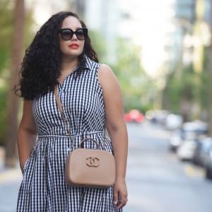 Tanesha Awasthi (a plus size Girl With Curves) wearing a gingham print shirtdress in downtown Vancouver.