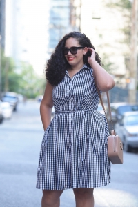 Tanesha Awasthi (a plus size Girl With Curves) wearing a gingham print shirtdress in downtown Vancouver.