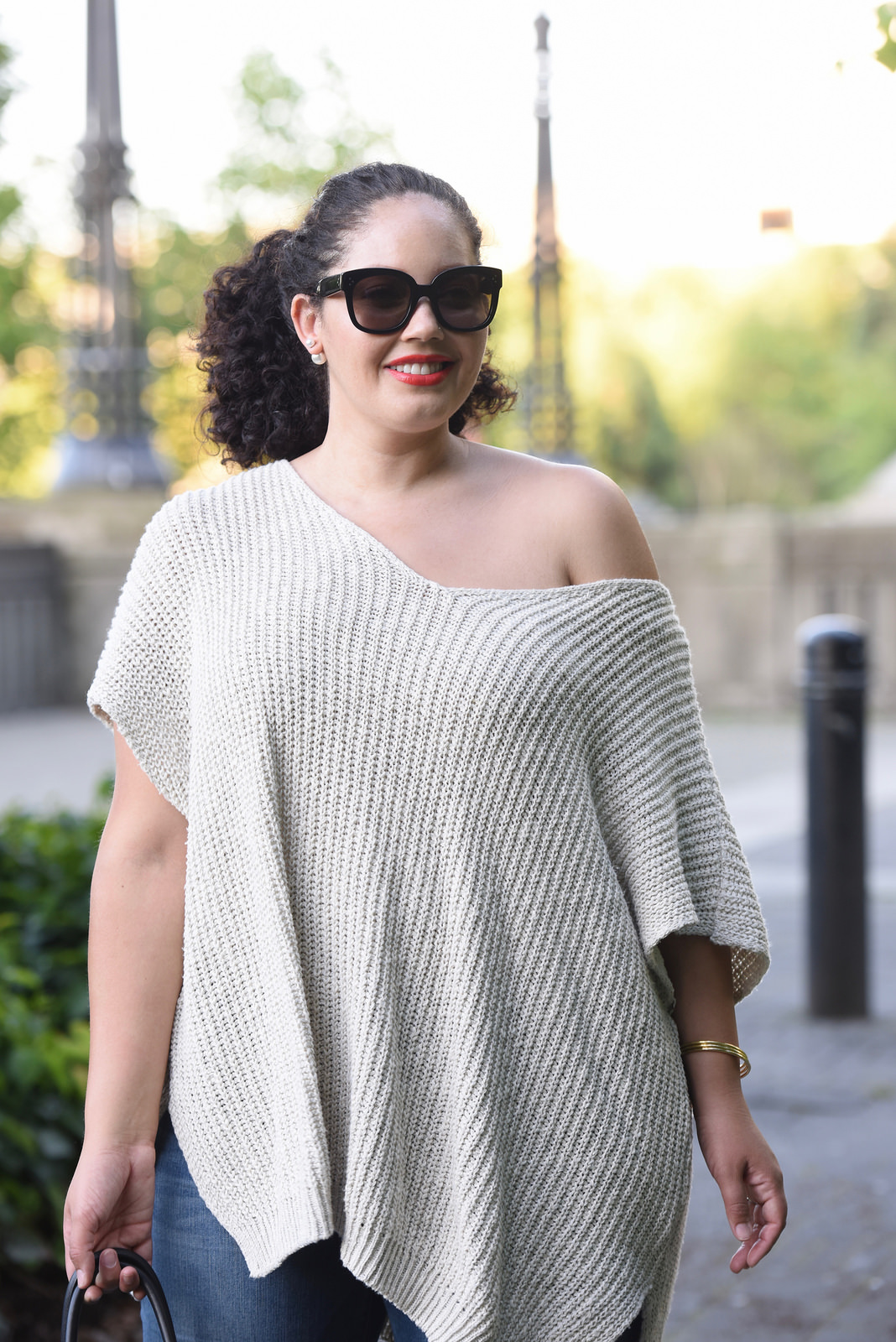 Tanesha Awasthi (formerly known as Girl with Curves) wearing an off the shoulder sweater.
