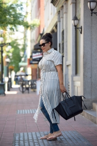 Tanesha Awasthi (formerly known as Girl with Curves) wearing a stripe shirtdress, skinny jeans and Celine Phantom in downtown Vancouver.