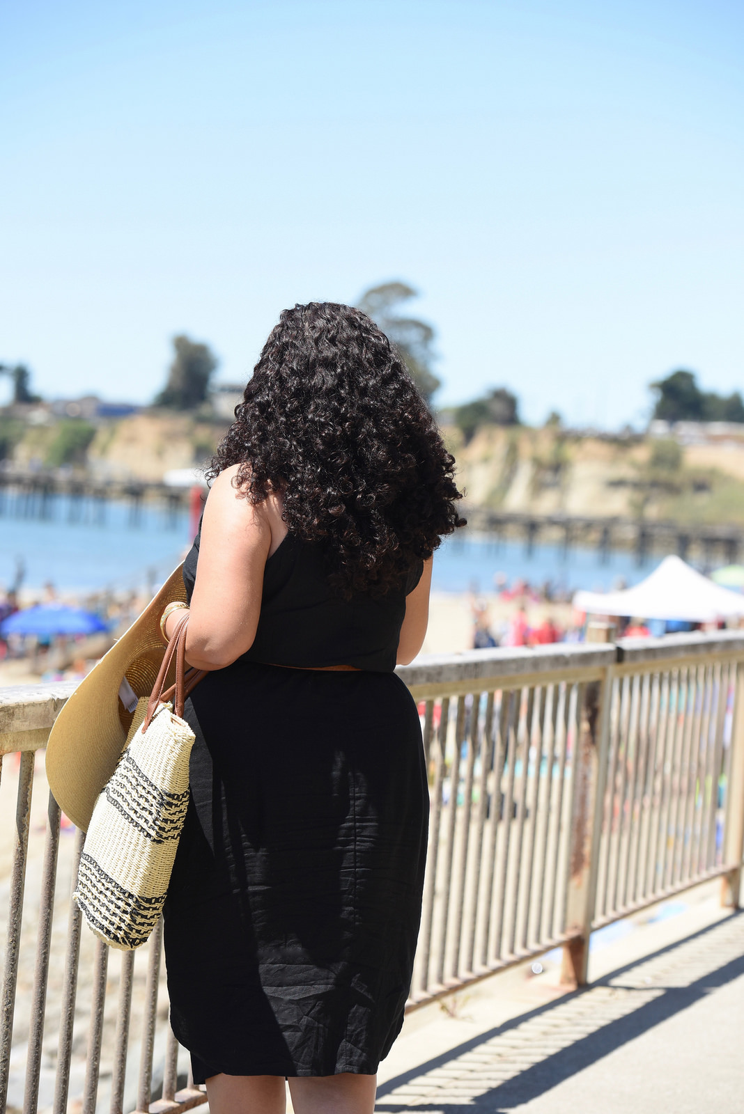 Tanesha Awasthi (formerly known as Girl With Curves) wearing a black shirtdress in Capitola.