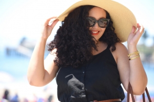 Tanesha Awasthi (formerly known as Girl with Curves) shows off her naturally curly hair in a floppy hat in Capitola.