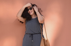 Tanesha Awasthi (formerly known as Girl with Curves) wearing a gingham jumpsuit and bucket bag.