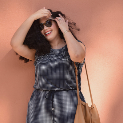 Tanesha Awasthi (formerly known as Girl with Curves) wearing a gingham jumpsuit and bucket bag.