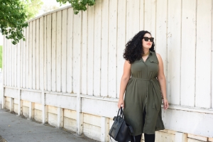 Tanesha Awasthi, also known as Girl With Curves, wearing a plus size shirtdress, leggings, Celine phantom, Celine sunglasses and orange lipstick.