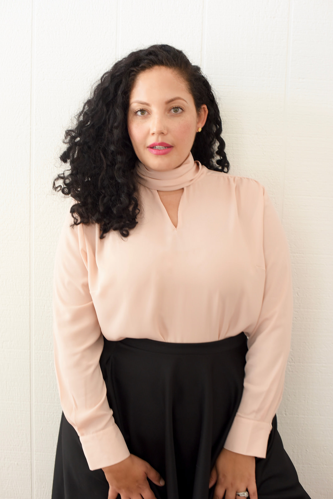Tanesha Awasthi, also known as Girl With Curves, shares 3 ways to style a tie-neck blouse.