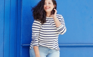 Tanesha Awasthi, also known as Girl With Curves, stars in Old Navy's Fall Denim Campaign wearing light wash plus size skinny jeans.