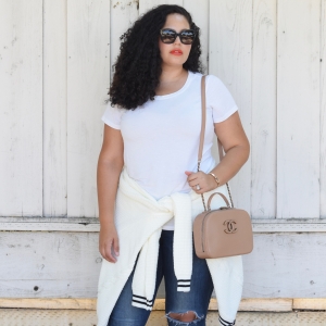 Tanesha Awasthi, also known as Girl With Curves, wearing a white tee and Chanel bag.