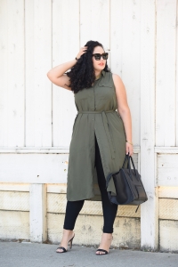 Tanesha Awasthi, also known as Girl With Curves, wearing a plus size shirtdress over leggings, Celine Audrey sunglasses, heels and Celine phantom.