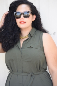 Tanesha Awasthi, also known as Girl With Curves, wearing a plus size shirtdress over leggings, Celine Audrey sunglasses, heels and Celine phantom.