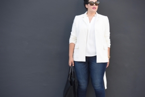 Tanesha Awasthi, also known as Girl With Curves, wearing a tailored blazer and skinny jeans.