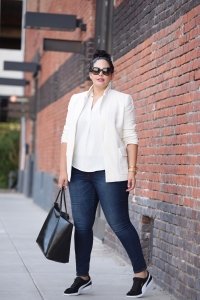 White blazer, dark denim jeans, Givenchy tote and Puma fashion sneakers worn by Tanesha Awasthi, also known as Girl With Curves.