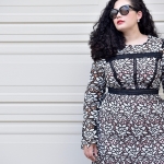 Girl with Curves blogger Tanesha Awasthi wearing a lace dress and Celine Audrey sunglasses