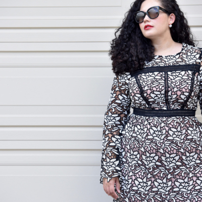 Girl with Curves blogger Tanesha Awasthi wearing a lace dress and Celine Audrey sunglasses