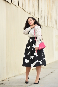 Girl With Curves blogger Tanesha Awasthi wearing a lace blouse and midi skirt from kate spade new york.