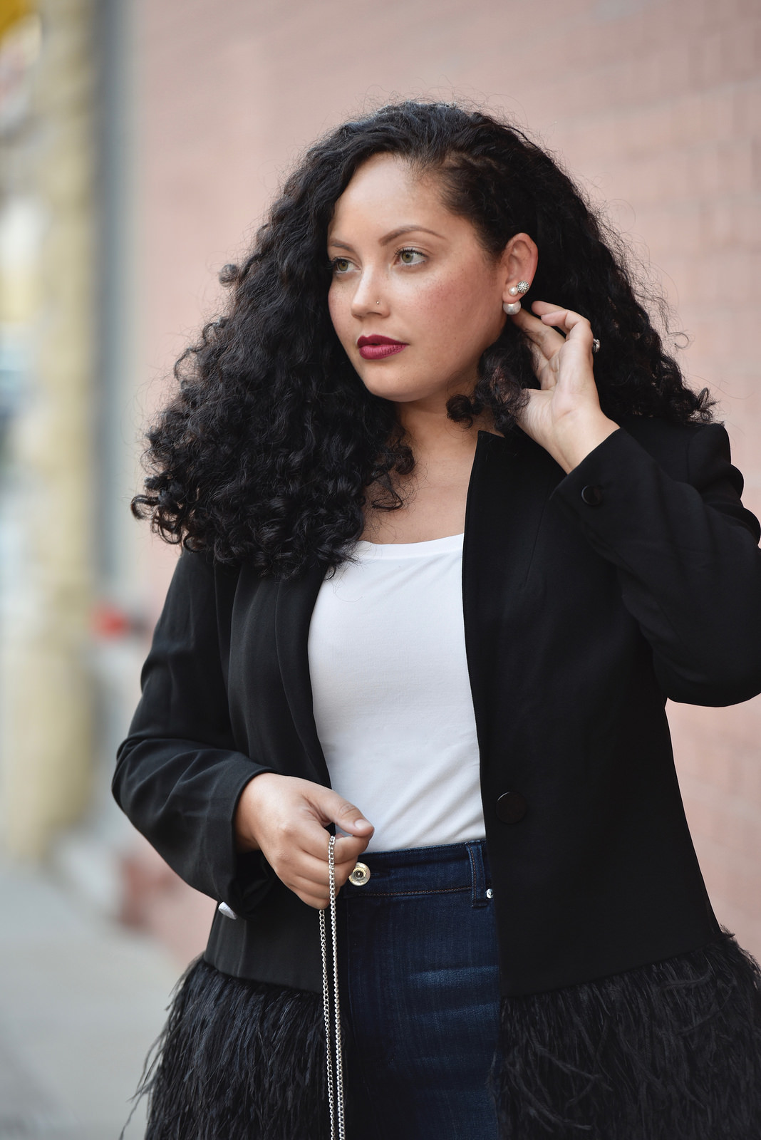 Girl With Curves blogger Tanesha Awasthi wears a feather blazer.
