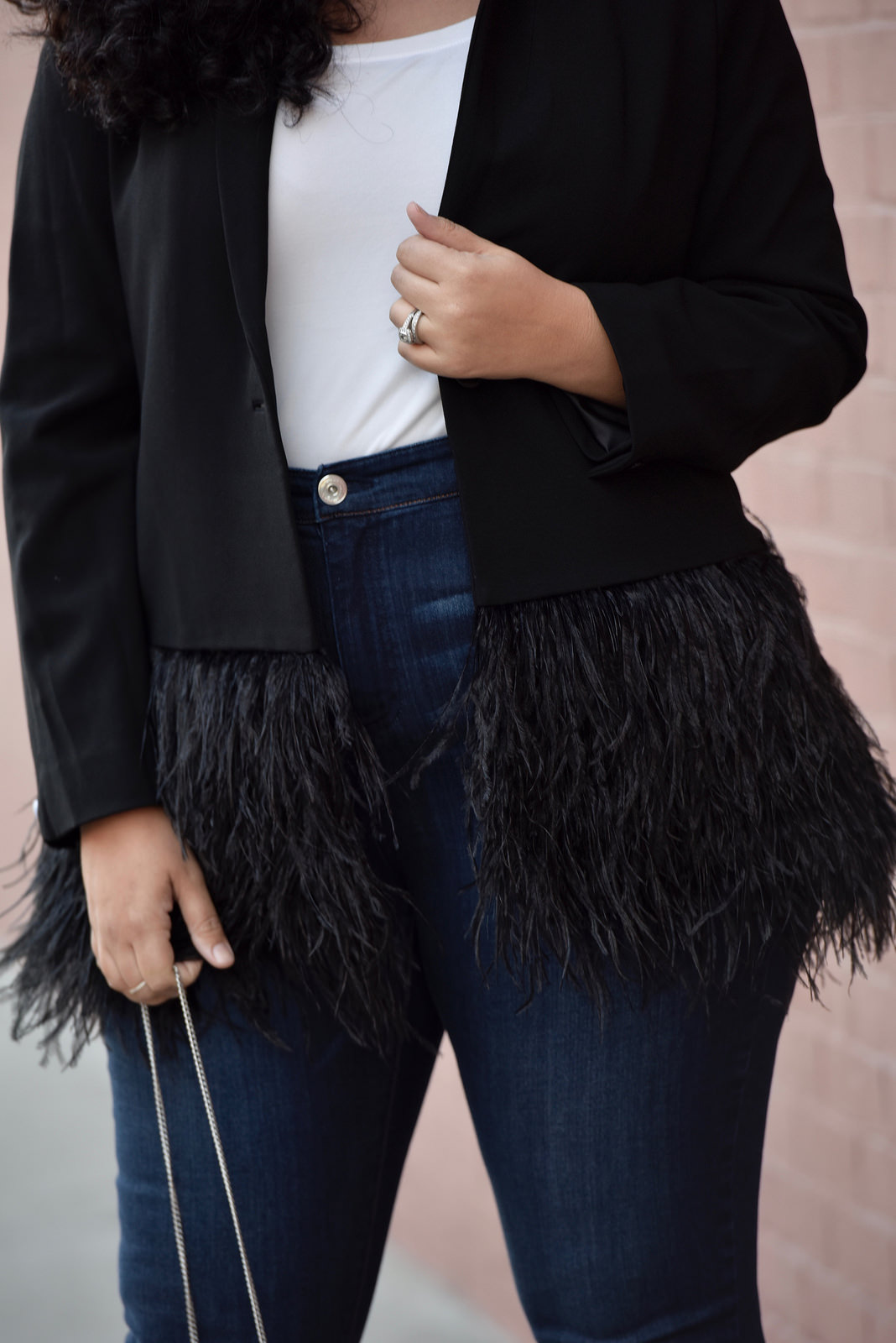 Girl With Curves blogger Tanesha Awasthi wears a feather blazer.