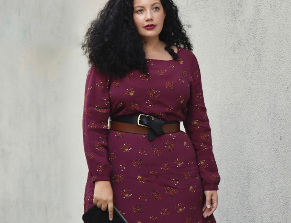 Girl With Curves blogger Tanesha Awasthi wears a belted floral midi dress.