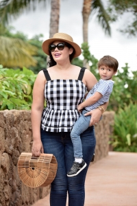 Girl With Curves blogger Tanesha Awasthi wears a gingham peplum and boater hat in Hawaii with her son, Narayan Awasthi.