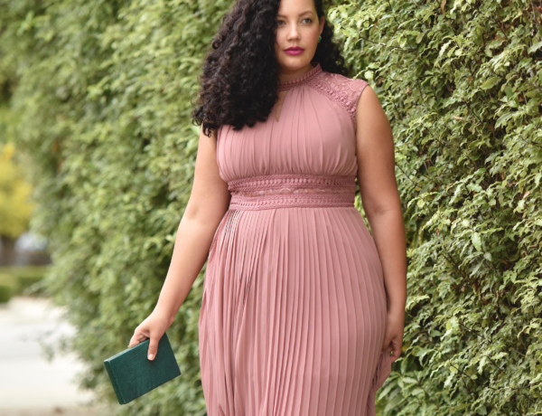 Girl With Curves blogger Tanesha Awasthi wears a pink plus size maxi dress with lace details.