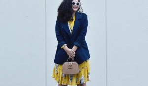Girl With Curves blogger Tanesha Awasthi, in post Winter Brights, is wearing an Old Navy yellow floral Dress and navy peacoat.