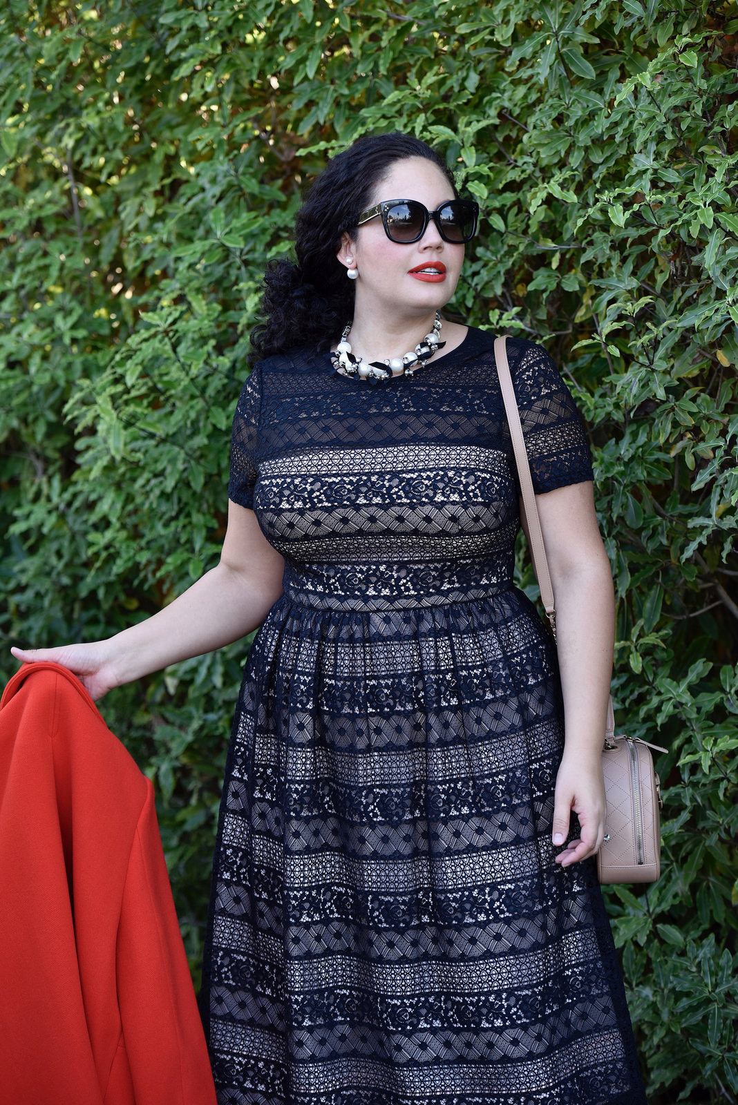 Girl With Curves wearing a pearl necklace from Ann Taylor, Audrey Sunglasses from Celine, Lace Dress from Maggy London at Nordstrom, Chanel bag.