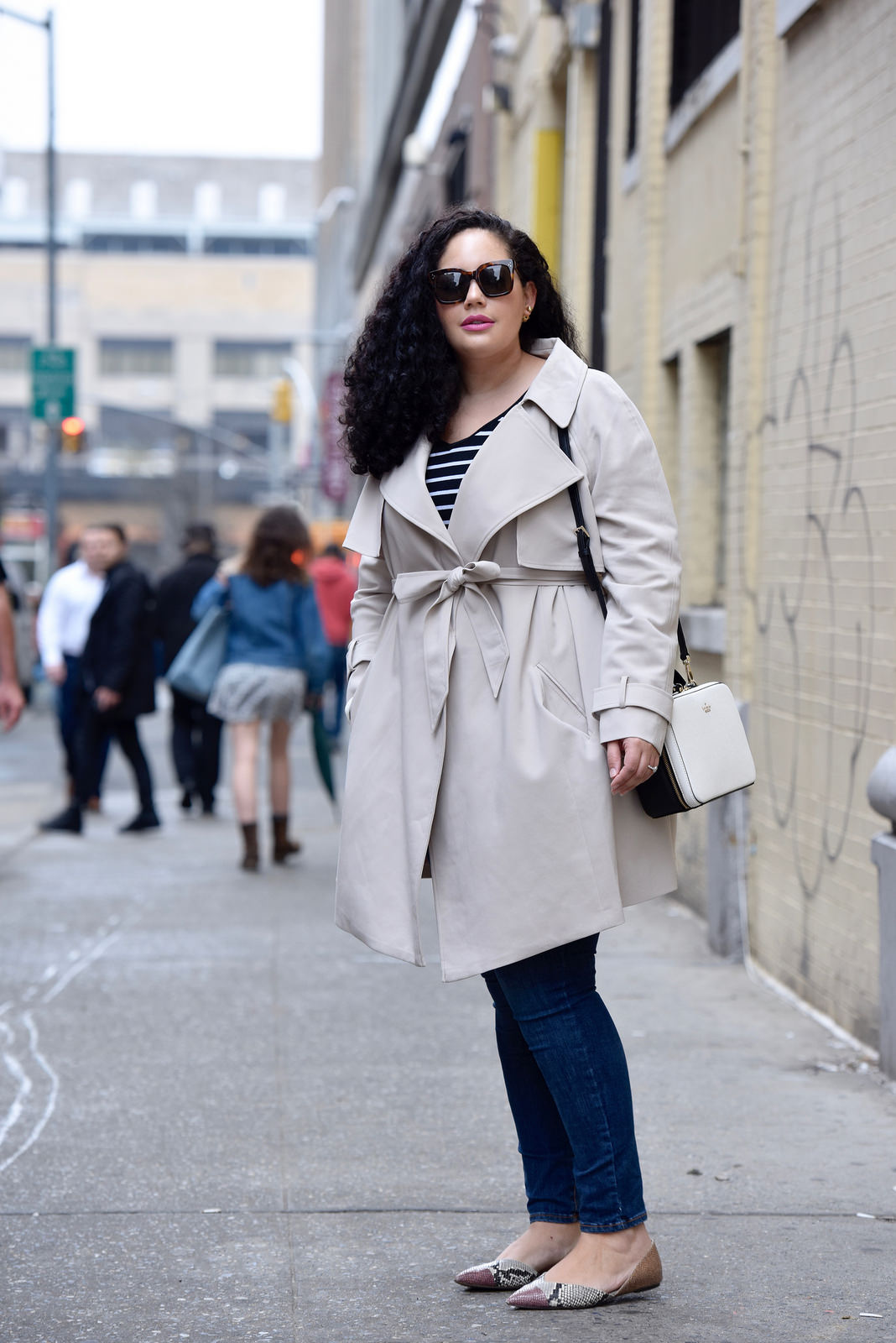 Girl with Curves wearing a trench coat from Asos, Kate Spade Casie bag, Rockstar jeans from Old navy and flats from J Crew.