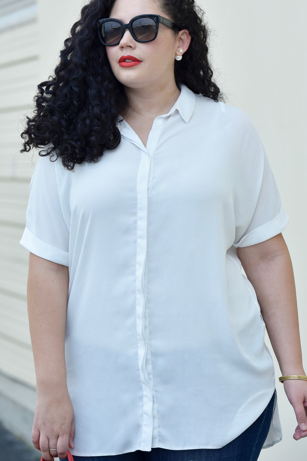 Tanesha Awasthi wearing a white blouse via Girl With Curves.